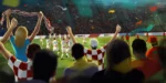 Nogometaši pozdravljaju navijače koji mašu hrvatskim zastavama na tribinama